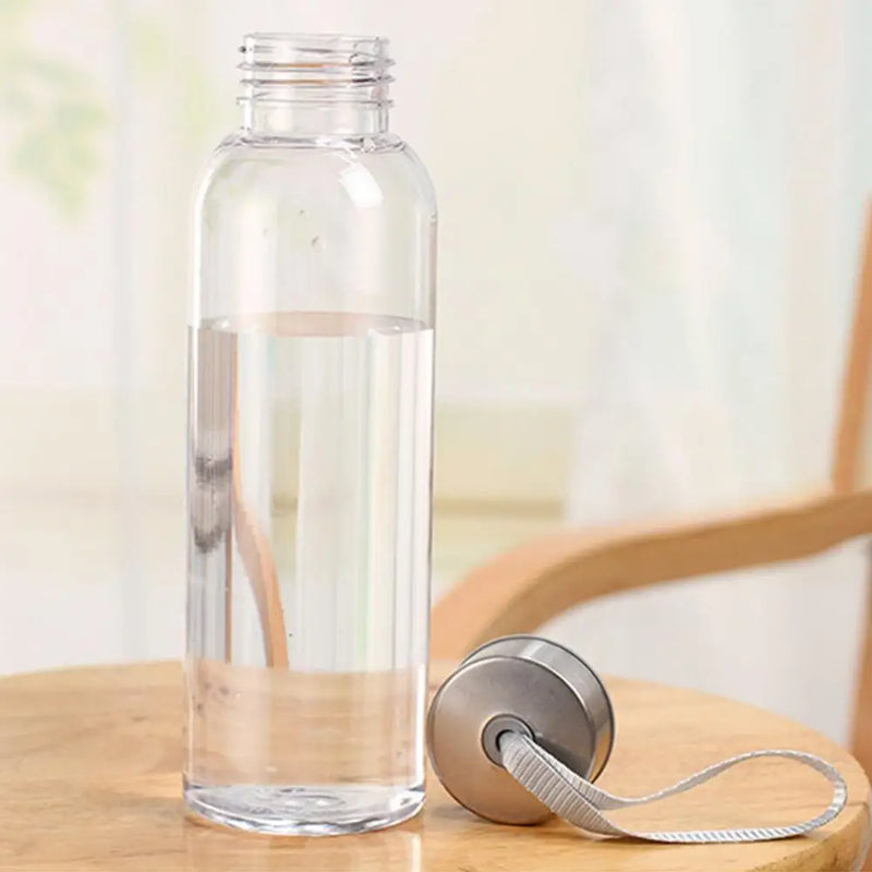 Plastic/reinforced bottle with handle on lid