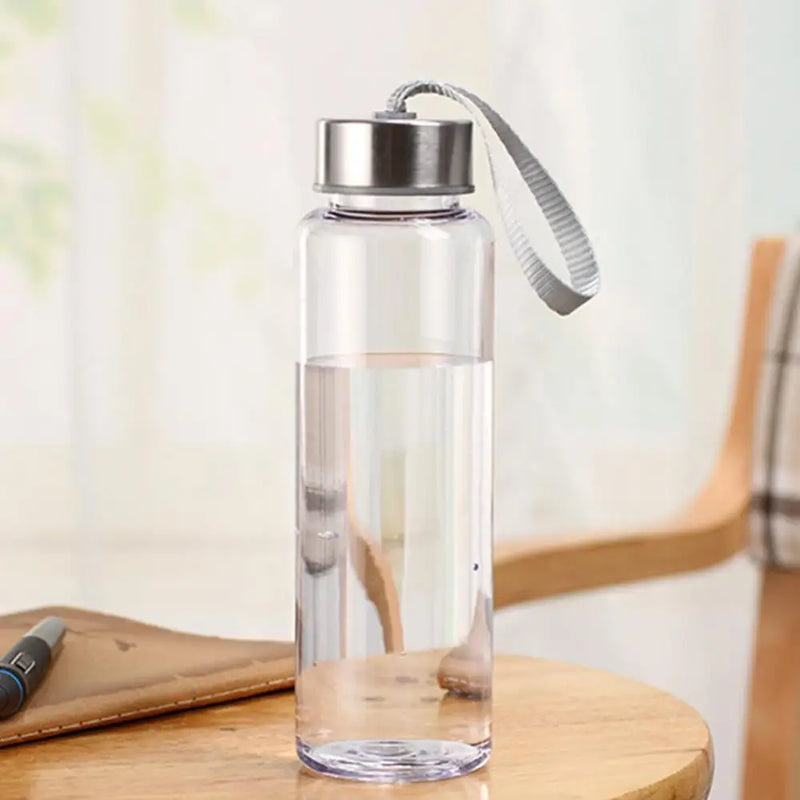 Plastic/reinforced bottle with handle on lid